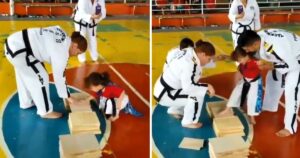 Questa piccola bambina fa sorridere tutti i presenti mentre si sforza di capire la lezione di taekwondo