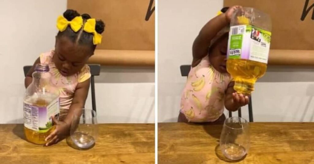 Il video adorabile e disastroso di una bimba che prova per la prima volta a servirsi un bicchiere di succo