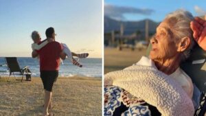 Nipote porta in braccio la nonna costretta a letto a vedere il tramonto sulla spiaggia